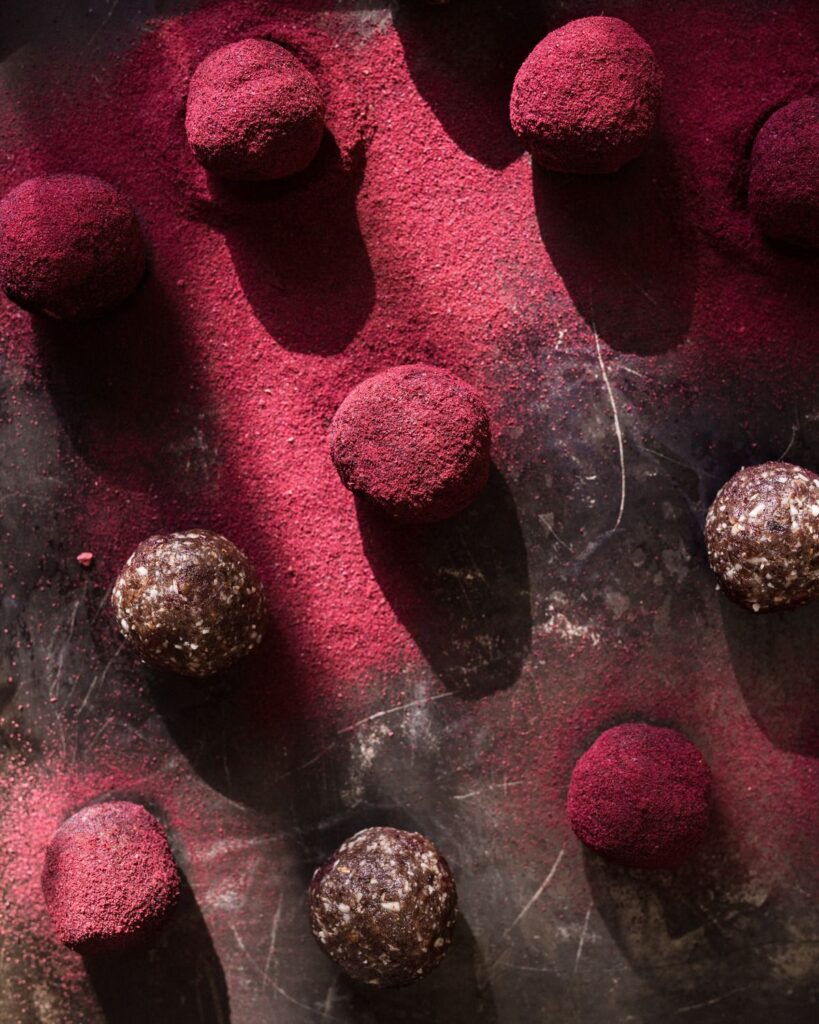 Antioxidant bliss balls covered in Australian Queen Garnet Powder