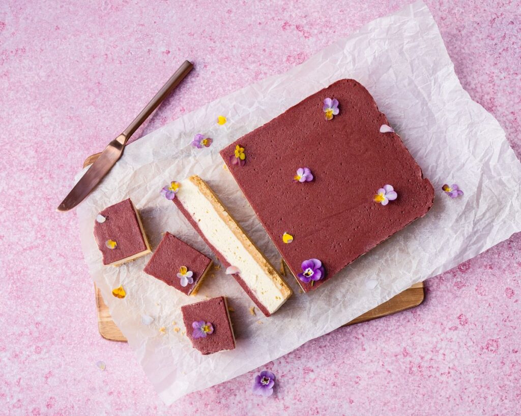 Plum + White Chocolate Cheesecake cut into small servings